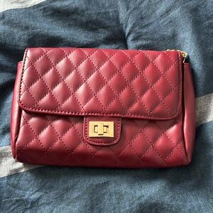 Quilted wine and gold clutch